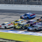 Oct 6, 2024; Talladega, Alabama, USA; Ryan Blaney (12) and Ross Chastain (1) are part of the lead pack seconds before their wreck in the final laps during the second stage of the YellaWood 500 at Talladega Superspeedway. Mandatory Credit: Vasha Hunt-Imagn Images