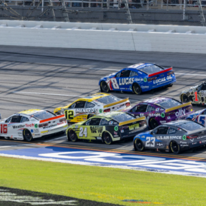 Oct 6, 2024; Talladega, Alabama, USA; Ryan Blaney (12) and Ross Chastain (1) are part of the lead pack seconds before their wreck in the final laps during the second stage of the YellaWood 500 at Talladega Superspeedway. Mandatory Credit: Vasha Hunt-Imagn Images