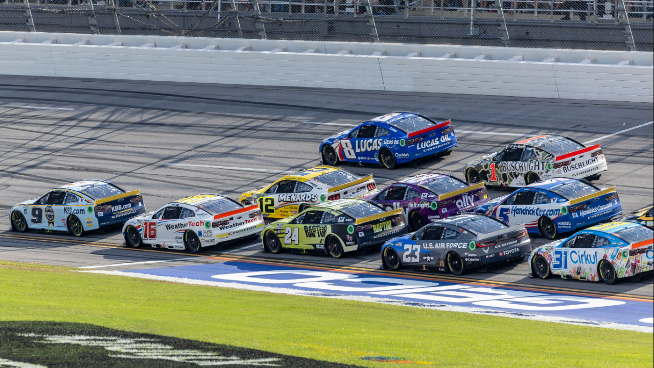 Oct 6, 2024; Talladega, Alabama, USA; Ryan Blaney (12) and Ross Chastain (1) are part of the lead pack seconds before their wreck in the final laps during the second stage of the YellaWood 500 at Talladega Superspeedway. Mandatory Credit: Vasha Hunt-Imagn Images