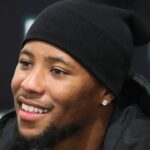 agles running back Saquon Barkley smiles as he poses for photos while making an autograph signing appearance to promote the opening of the Dick's House of Sport store at the Brandywine Town Center.