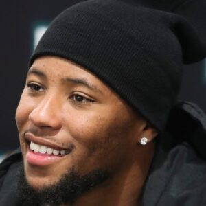 agles running back Saquon Barkley smiles as he poses for photos while making an autograph signing appearance to promote the opening of the Dick's House of Sport store at the Brandywine Town Center.