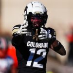 Nov 29, 2024; Boulder, Colorado, USA; Colorado Buffaloes wide receiver Travis Hunter (12) celebrates his first down reception in the fourth quarter against the Oklahoma State Cowboys at Folsom Field.