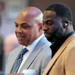 Charles Barkley (left) and Draymond Green (right) look on in the first half between the Dallas Mavericks and the Minnesota Timberwolves during game three of the western conference finals for the 2024 NBA playoffs at American Airlines Center.