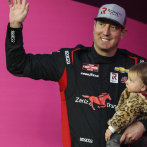 LAS VEGAS, NV - MARCH 03: Kyle Busch ( 51 Zariz Transport Chevrolet) and daughter on stage prior to the start of the NASCAR, Motorsport, USA Craftsman Truck Series Victoria s Voice Foundation 200, on March 3, 2023, at Las Vegas Motor Speedway in Las Vegas, NV.(Photo by Christopher Trim Icon Sportswire) AUTO: MAR 03 NASCAR Craftsman Truck Series Victoria s Voice Foundation 200 Icon23030306200