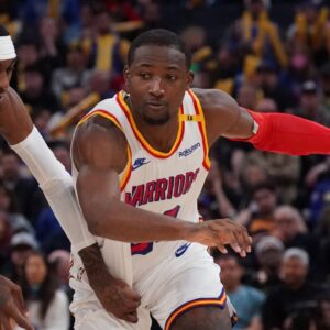 Golden State Warriors forward Jonathan Kuminga (00) dribbles by Minnesota Timberwolves forward Jaden McDaniels (3) in the fourth period at Chase Center.