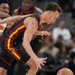 Atlanta Hawks guard Dyson Daniels (5) steals the ball during the second half at State Farm Arena.