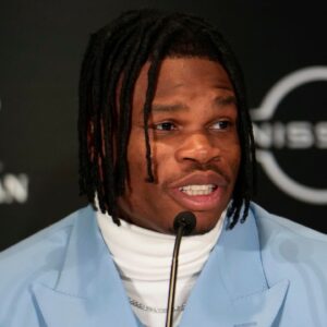 Colorado Buffaloes wide receiver/cornerback Travis Hunter speaks on stage during a press conference before the 2024 Heisman Trophy Presentation.