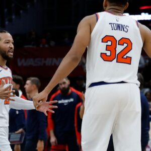 New York Knicks guard Jalen Brunson (11) celebrates with Knicks center Karl-Anthony Towns (32) against the Washington Wizards in the fourth quarter at Capital One Arena.