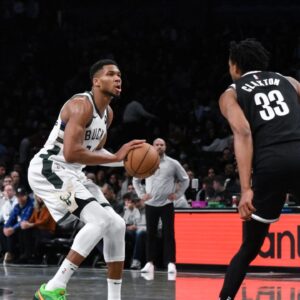 Milwaukee Bucks forward Giannis Antetokounmpo (34) looks to shoot the ball as Brooklyn Nets center Nic Claxton (33) defends during the second half at Barclays Center.
