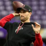 Atlanta Falcons quarterback Kirk Cousins (18) warms up before the game against the Minnesota Vikings at U.S. Bank Stadium.