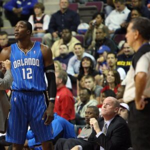 Orlando Magic center Dwight Howard (12) fouls out in the fourth quarter and talks with head coach Stan Van Gundy at The Palace of Auburn Hills. The Pistons defeated the Magic 85-80.