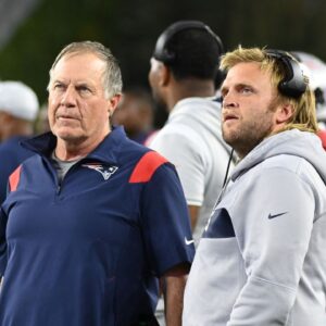 New England Patriots head coach Bill Belichick (left) and Steve Belichick, linebackers coach (right) watch the in stadium displays during the first half of a preseason against the Carolina Panthers game at Gillette Stadium.