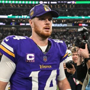 Minnesota Vikings quarterback Sam Darnold (14) walks off the field after the game against the Green Bay Packers at U.S. Bank Stadium.