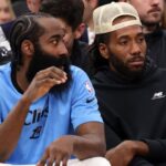 Los Angeles Clippers guard James Harden (1, left) and Kawhi Leonard (right) watch the game against the Utah Jazz from the bench during the fourth quarter at Intuit Dome.