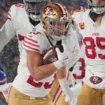 Dec 1, 2024; Orchard Park, New York, USA; San Francisco 49ers running back Christian McCaffrey (23) runs with the ball against the Buffalo Bills during the first half at Highmark Stadium.