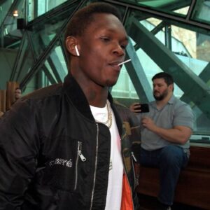 UFC 243 WHITTAKER ADESANYA MEDIA OPP, Israel Adesanya (centre) arrives to the UFC 243 card press conference, PK, Pressekonferenz Federation Square, Melbourne, Thursday, August 15, 2019. UFC middleweight champion, Robert Whittaker and UFC interim middleweight champion, Israel Adesanya will face off in the UFC243 card at Marcel stadium on October 6, 2019.
