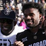 Nov 29, 2024; Boulder, Colorado, USA; Colorado Buffaloes safety Shilo Sanders (21) and head coach Deion Sanders and quarterback Shedeur Sanders (2) and social media producer Deion Sanders Jr. following the win against the Oklahoma State Cowboys at Folsom Field.