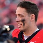 Georgia quarterback Carson Beck (15) speaks with the media after a NCAA college football game against Massachusetts in Athens, Ga., on Saturday, Nov. 23, 2024. Georgia won 59-21.