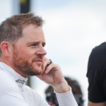 Justin Marks talks with a crew member after Trans Am practice Friday, July 7, 2023, at Road America in Elkhart Lake, Wisconsin.