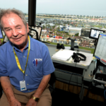 Jul 5, 2014; Daytona Beach, FL, USA; Motor Racing Network radio announcer Barney Hall pauses for a portrait in the radio booth during the Coke Zero 400 at Daytona International Speedway. Mandatory Credit: John David Mercer-Imagn Images