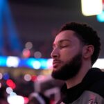 Brooklyn Nets point guard Ben Simmons (10) stands for the National Anthem before the game against the Portland Trail Blazers at Moda Center.