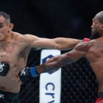 Tony Ferguson (red gloves) fights Bobby Green (blue gloves) during UFC 291 at Delta Center.