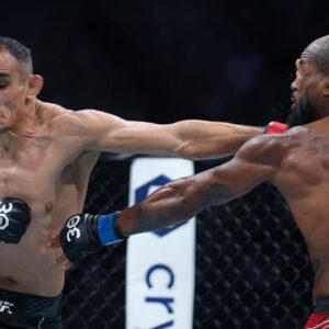 Tony Ferguson (red gloves) fights Bobby Green (blue gloves) during UFC 291 at Delta Center.