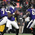 Baltimore Ravens quarterback Lamar Jackson (8) looks to pass in the second quarter against the Pittsburgh Steelers in an AFC wild card game at M&T Bank Stadium.