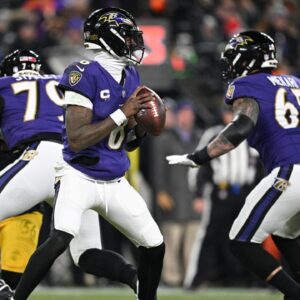 Baltimore Ravens quarterback Lamar Jackson (8) looks to pass in the second quarter against the Pittsburgh Steelers in an AFC wild card game at M&T Bank Stadium.