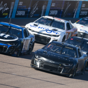 Jan 24, 2023; Avondale, AZ, USA; NASCAR Cup Series driver Erik Jones (43) races alongside Ross Chastain (1) during testing at Phoenix Raceway. Mandatory Credit: Mark J. Rebilas-Imagn Images