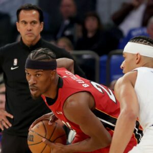 Miami Heat head coach Erik Spoelstra watches as Heat forward Jimmy Butler (22) controls the ball against New York Knicks guard Josh Hart (3) during the first quarter of game one of the 2023 NBA Eastern Conference semifinal playoffs at Madison Square Garden.