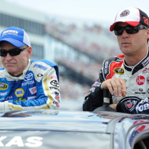 Sprint Cup Series driver Mark Martin (55) and driver Kevin Harvick (29) wait for the start of the FedEx 400 Benefiting Autism Speaks at Dover International Speedway.