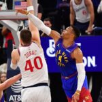 Los Angeles Clippers center Ivica Zubac (40) moves to the basket against Denver Nuggets center Nikola Jokic (15) and guard Russell Westbrook (4) during the second half at Intuit Dome