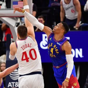 Los Angeles Clippers center Ivica Zubac (40) moves to the basket against Denver Nuggets center Nikola Jokic (15) and guard Russell Westbrook (4) during the second half at Intuit Dome