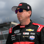 May 1, 2023; Dover, Delaware, USA; NASCAR Cup Series driver Kyle Busch stands on pit road prior to the Wurth 400 at Dover Motor Speedway. Mandatory Credit: Matthew OHaren-Imagn Images