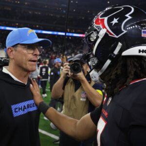 Jan 11, 2025; Houston, Texas, USA; Houston Texans quarterback C.J. Stroud (7) hugs Los Angeles Chargers head coach Jim Harbaugh after defeating the Los Angeles Chargers in an AFC wild card game at NRG Stadium.