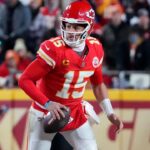 Jan 26, 2025; Kansas City, MO, USA; Kansas City Chiefs quarterback Patrick Mahomes (15) rushes the ball against the Buffalo Bills during the second half in the AFC Championship game at GEHA Field at Arrowhead Stadium.