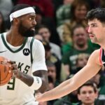 Milwaukee Bucks forward Bobby Portis (9) is guarded by Portland Trail Blazers forward Deni Avdija (8) in the second quarter at Fiserv Forum.