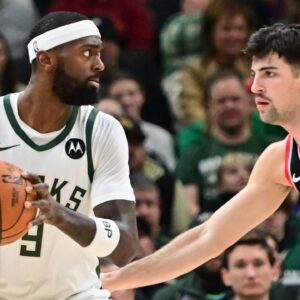 Milwaukee Bucks forward Bobby Portis (9) is guarded by Portland Trail Blazers forward Deni Avdija (8) in the second quarter at Fiserv Forum.