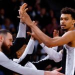 San Antonio Spurs players Victor Wembanyama and Sandro Mamukelashvili celebrate against the Indiana Pacers in the Paris Games 2025 NBA basketball game at Accor Arena.