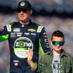 Feb 19, 2024; Daytona Beach, Florida, USA; NASCAR Cup Series driver Kyle Busch with son Brexton Busch during the Daytona 500 at Daytona International Speedway. Mandatory Credit: Mark J. Rebilas-Imagn Images