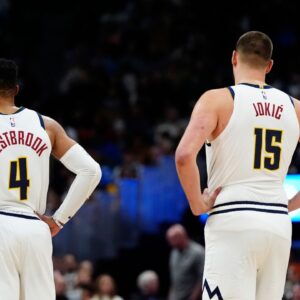 Denver Nuggets guard Russell Westbrook (4) and center Nikola Jokic (15) during the third quarter against the Atlanta Hawks at Ball Arena.