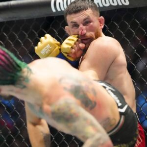 Sean OíMalley of the United States (red gloves) fights Merab Dvalishvili of Georgia (blue gloves) during Riyadh Season Noche UFC 306 at The Sphere.