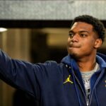 Michigan defensive back Will Johnson (2) high-fives fans during warm up before the Michigan State game at Michigan Stadium in Ann Arbor on Saturday, Oct. 26, 2024.