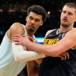 San Antonio Spurs center Victor Wembanyama (1) and Denver Nuggets center Nikola Jokic (15) battle for position during an inbound pass in the second half at Frost Bank Center.