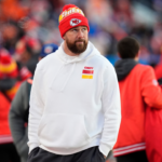 Kansas City Chiefs tight end Travis Kelce (87) walks the sidelines in the second half against the Denver Broncos at Empower Field at Mile High.