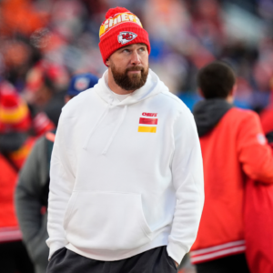 Kansas City Chiefs tight end Travis Kelce (87) walks the sidelines in the second half against the Denver Broncos at Empower Field at Mile High.