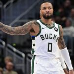 Milwaukee Bucks guard Damian Lillard (0) gestures in the third quarter against the Portland Trail Blazers at Fiserv Forum.
