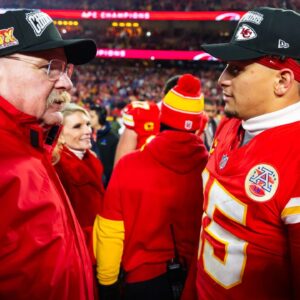 Kansas City Chiefs head coach Andy Reid (left) with quarterback Patrick Mahomes (15) after defeating the Buffalo Bills in the AFC Championship game at GEHA Field at Arrowhead Stadium.