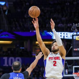 Detroit Pistons guard Cade Cunningham (2) shoots against Orlando Magic guard Jalen Suggs (4) during the first quarter at Kia Center.